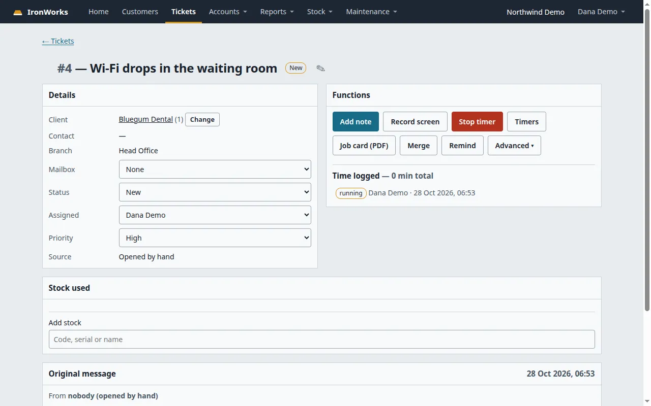 An IronWorks support ticket, "Wi-Fi drops in the waiting room", with its client, branch, status, assignee and priority on the left. On the right are buttons for Add note, Stop timer, Job card (PDF), Merge and Remind, and a running timer entry. A Stock used panel sits below.